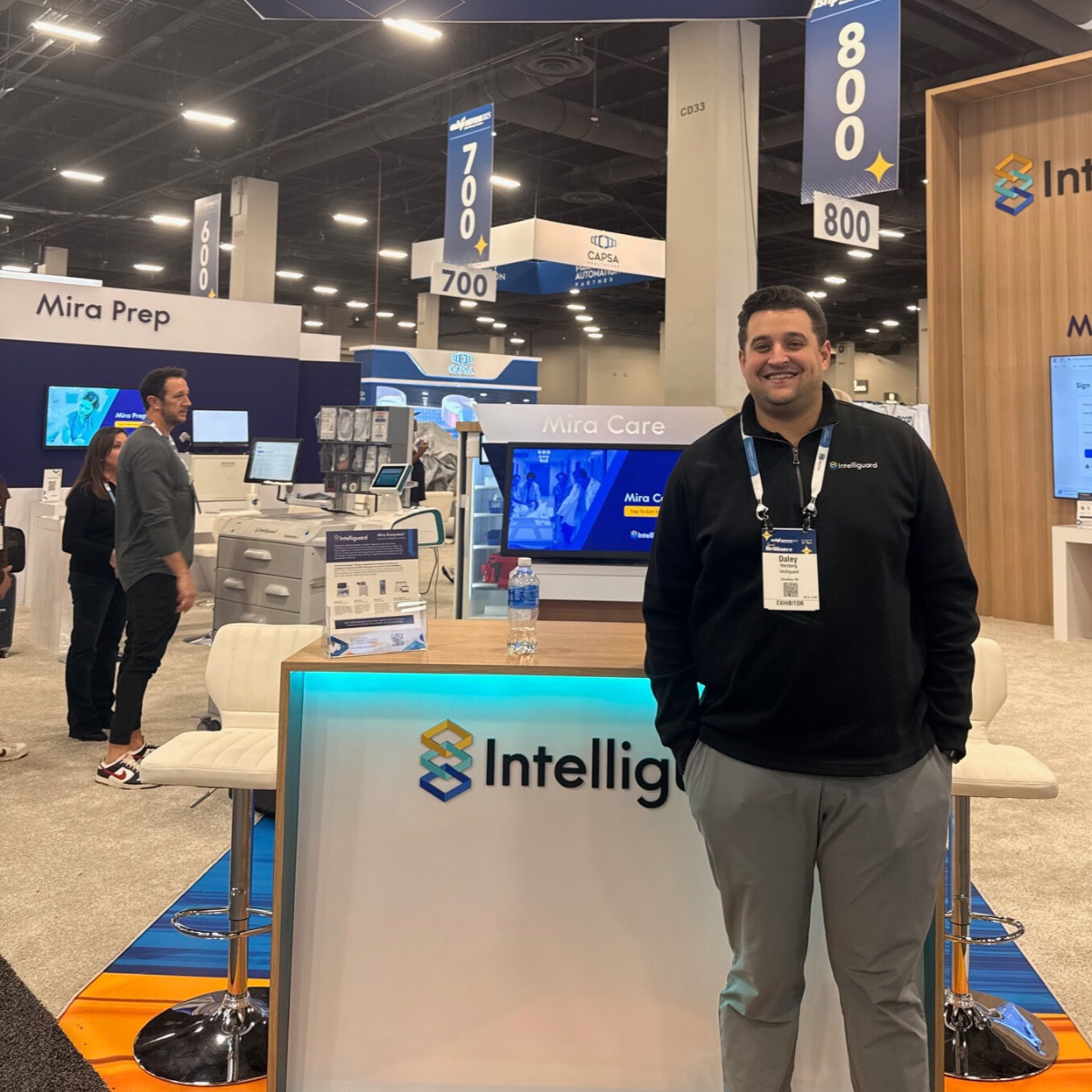 Intelliguard employee smiling at the booth